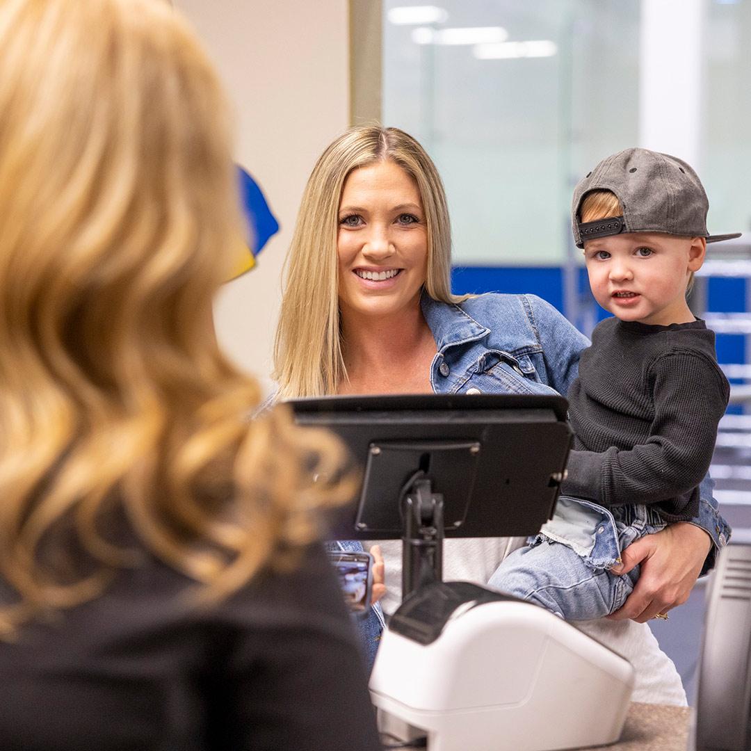 Young boy playing on a slide indoors