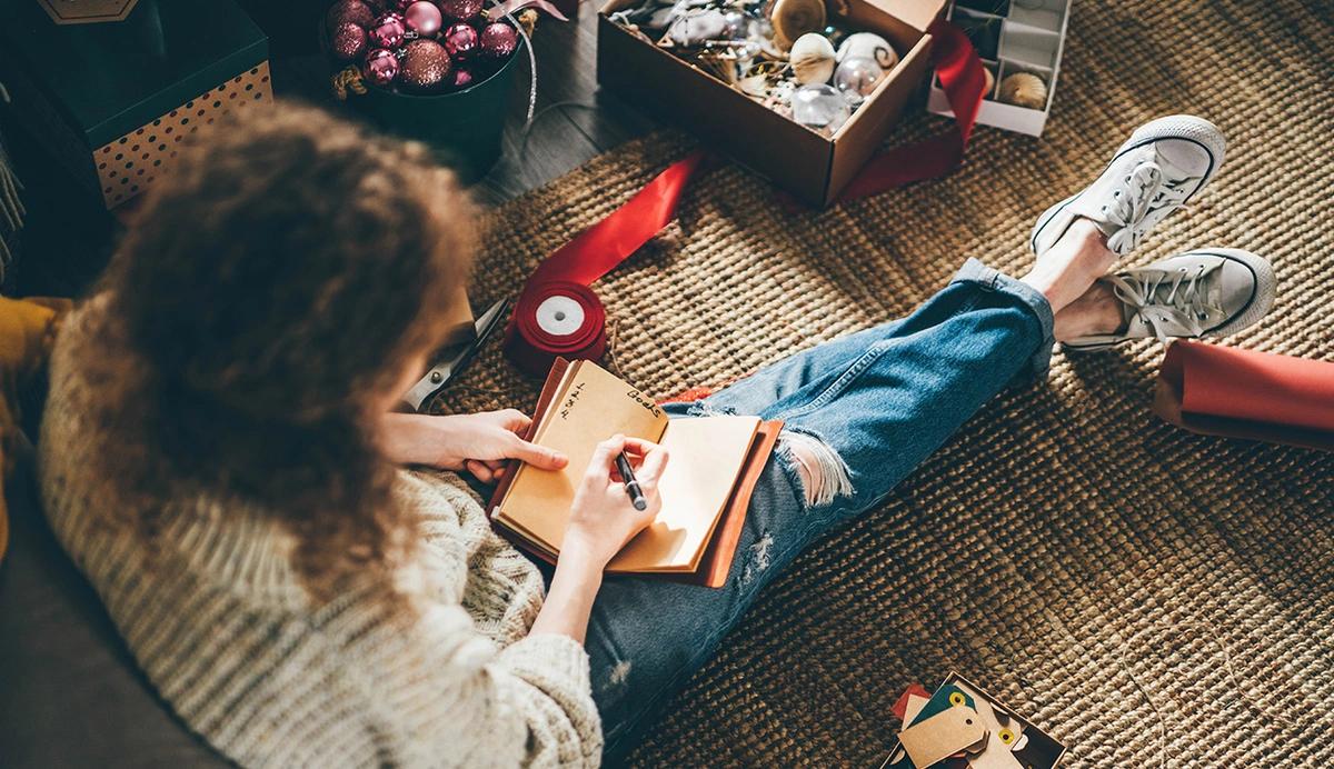 woman writing in a notebook