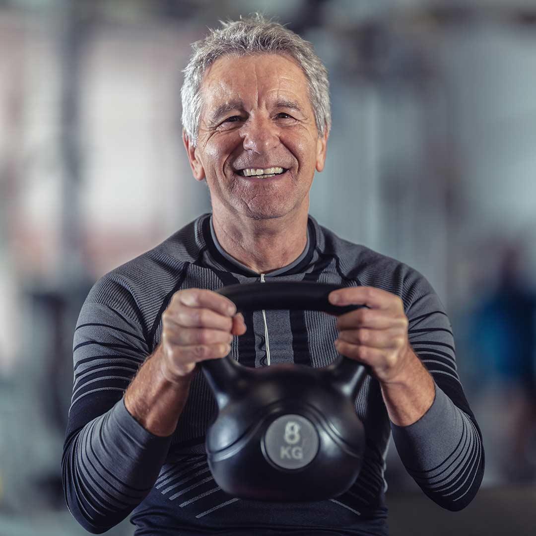 Man stretching in class